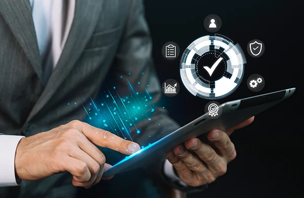 Man in suit working on tablet, with graphic elements depicting data