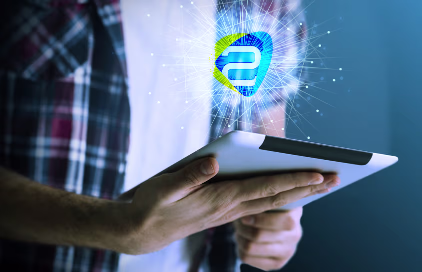 Tablet in hands, with graphic elements hovering over the screen